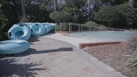 Blue Inner Tubes Lined Up Outside Stock Footage 114583869