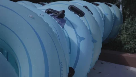 Blue Inner Tubes Lined Up Outside Video stock 114583878