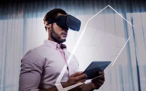 Blue interface against businessman using an oculus Stock Photos