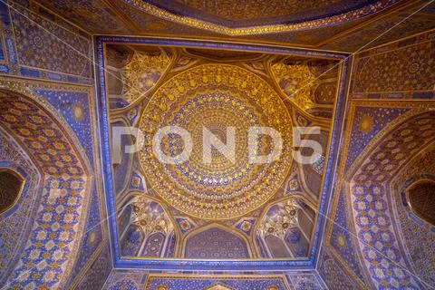 Blue interior with gold gild of Tile Karl Madrasa in The Registan, Samarkand, Stock Photos