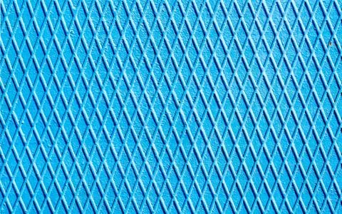 Blue iron wall with intersecting lines close up blue iron wall with inters... Stock Photos