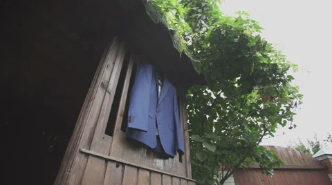 Blue jacket hanging on the wood background Stock Footage 58040429