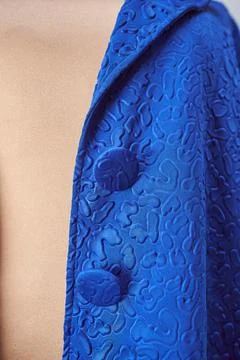 Blue jacket lapel with buttons in the same color. Stock Photos