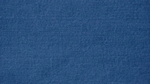 Blue jeans cloth macro texture. Denim clothes texture closeup, dolly shot Stock Footage 138877831