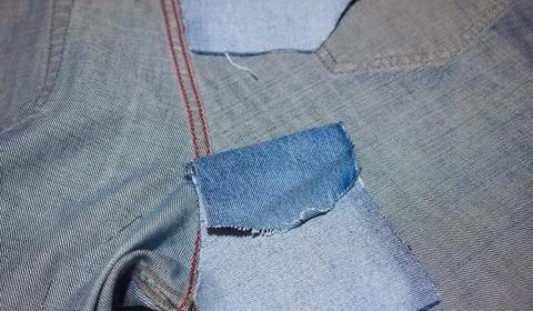 Blue jeans fabric texture with patch Stock Photos