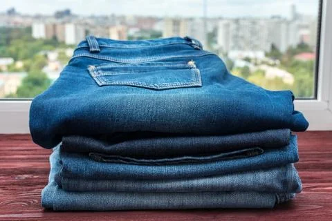 Blue jeans on a red background Stock Photos