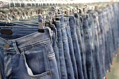 Blue jeans. Shop background. Stock Photos