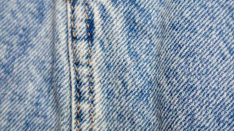 Blue jeans texture as a background Stock Photos
