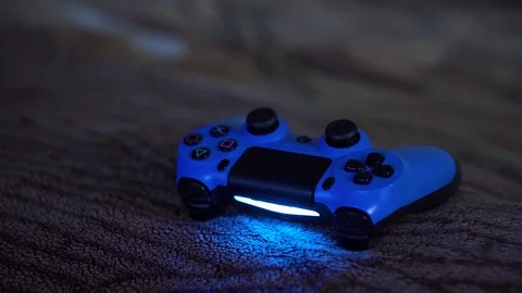 Blue joystick gamepad, game console Computer gaming competition videogame Stock Footage 106064236