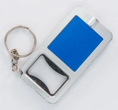 Blue key ring that is also a bottle opener Foto stock