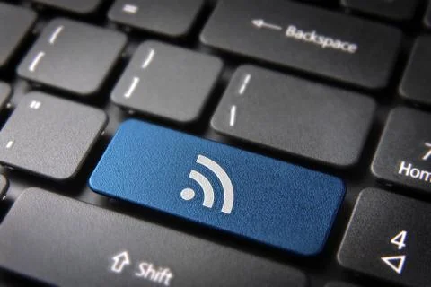 Blue keyboard key rss icon, internet technology background Stock Photos