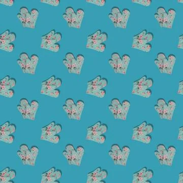 Blue kitchen gloves with shadow on blue background seamless pattern. Foto stock