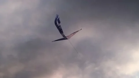 Blue kite soars in the sunset sky. Stock Footage 153415270