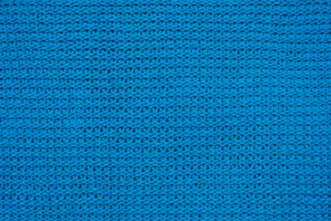 Blue knitted background texture of fabric Stock Photos