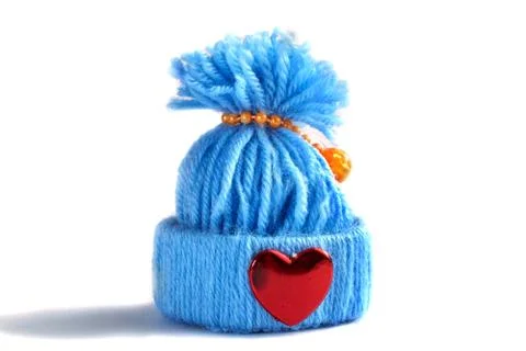 Blue knitted hat with a heart Stock Photos