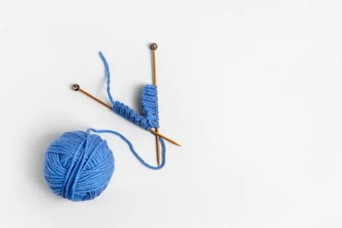 Blue knitted wool and knitting needles Stock Photos