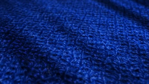 Blue knitted wool, pullover fabric is waving background. Stock Footage 108971545