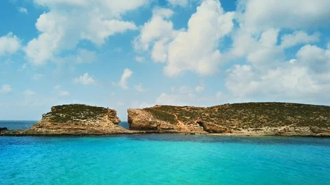 Blue lagoon and clouds in Comino island - part of maltese islands. Malta Stock Footage 106403758