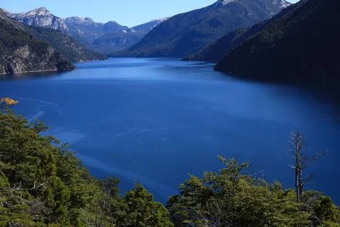 Blue Lake Between Mountain Ranges in Patagonia Stock Photos