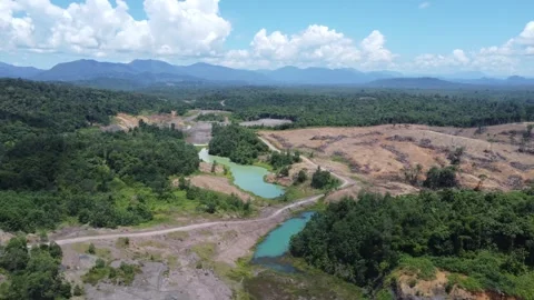 Blue Lake, a former mining site and barren area on the island of Kalimantan.. Stock Footage 322956005