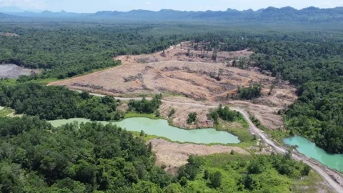 Blue Lake, a former mining site and barren area on the island of Kalimantan.. Stock Footage 322956025