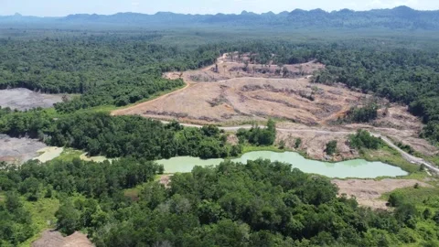 Blue Lake, a former mining site and barren area on the island of Kalimantan.. Stock Footage 322956027