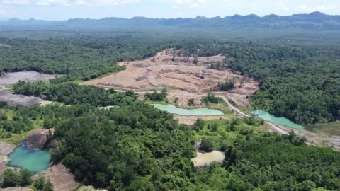 Blue Lake, a former mining site and barren area on the island of Kalimantan.. Stock Footage 322956049