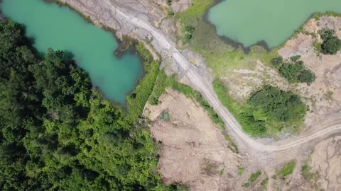 Blue Lake, a former mining site and barren area on the island of Kalimantan.. Stock Footage 322956132