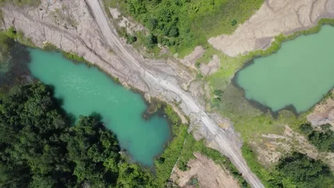 Blue Lake, a former mining site and barren area on the island of Kalimantan.. Stock Footage 322956186