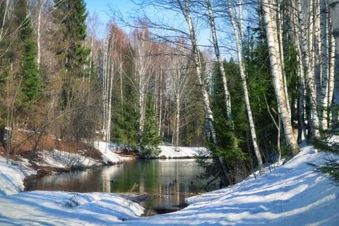 Blue lake has thawed in the spring Stock Photos