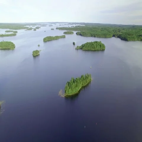 Blue lake Konnevesi with islands in Finland, aerial shot Stock Footage