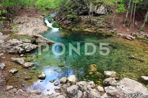 Blue lake on mountain river Stock Photos