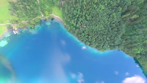 Blue Lake Next To Forest Stock Footage 142241080