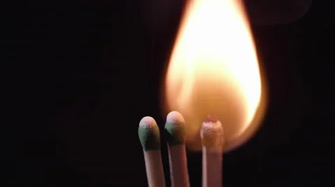 Blue laser pointer lighting match which set fire to others. Stock Footage 62323190