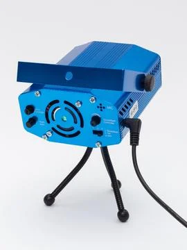 Blue laser stage light projector on tripod stand Stock Photos