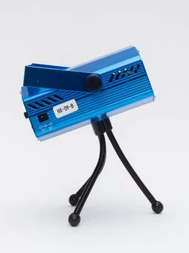Blue laser stage light projector on tripod Stock Photos