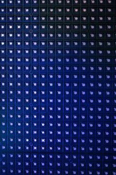 Blue LED Grid Pattern with Repetitive Light Squares Foto stock