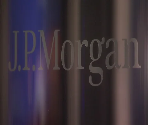 Blue LED stock ticker reflected in glass over JP Morgan lettering. Stock Footage 86749647