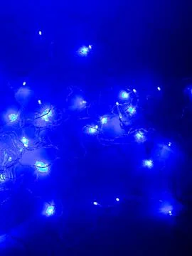 Blue led string lights bokeh close up Stock Photos