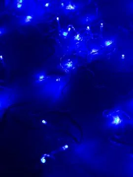 Blue led string lights scattered bokeh Stock Photos