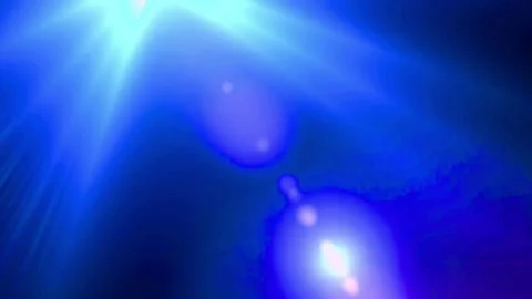 Blue light beams shining through darkness. Glowing bokeh effect background Stock Footage 334309307