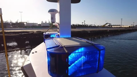 Blue light blinking over the fireboat at dusk Stock Footage 116503796