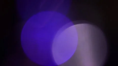Blue light, large purple and blue bokeh in the dark Vidéo 309845321