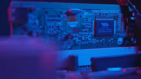 Blue light macro electronic part of a computer disassemble the laptop debrief Stock Footage 122083383