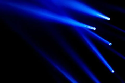 Blue light rays spotlight for show concert and night club concept. Abstract l Stock Photos