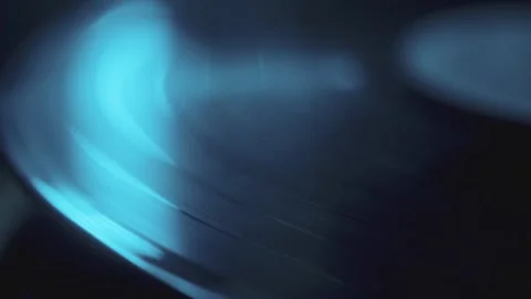 Blue Light Reflecting On Rotating Vinil Record Stock Footage 294991416