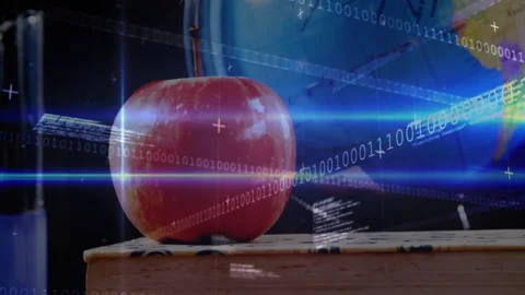 Blue light streaks causing binary code flowing over apple book and globe showing Stock Footage 316185684