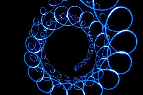 Blue light vortex on black 写真素材