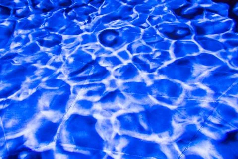 Blue light wave pattern on stone background Stock Photos