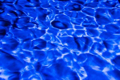 Blue light wave pattern on stone background Stock Photos